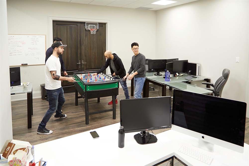 Employees Playing Foosball